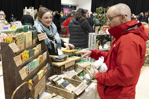 Stallholder and customer at 2023 Christmas Market