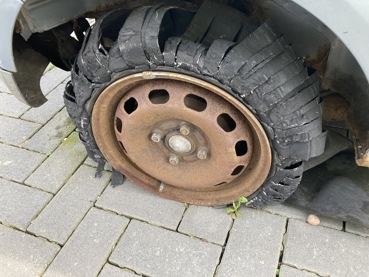 wrecked car tyre of a Ford FIesta abandoned at Boxworth Services