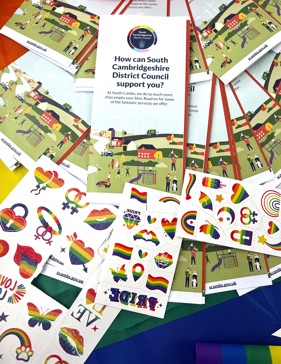 Cambridge Pride stall with Council leaflets and rainbow temporary tattoos