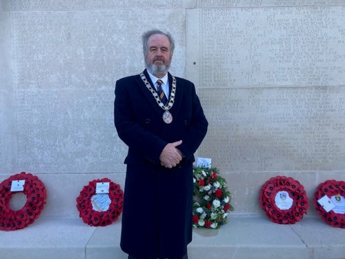 Cllr Peter Fane, Chair of South Cambridgeshire District Council, pictured in front of poppy wreaths at the Veterans Day Ceremony at Cambridge American Cemetery and Memorial.